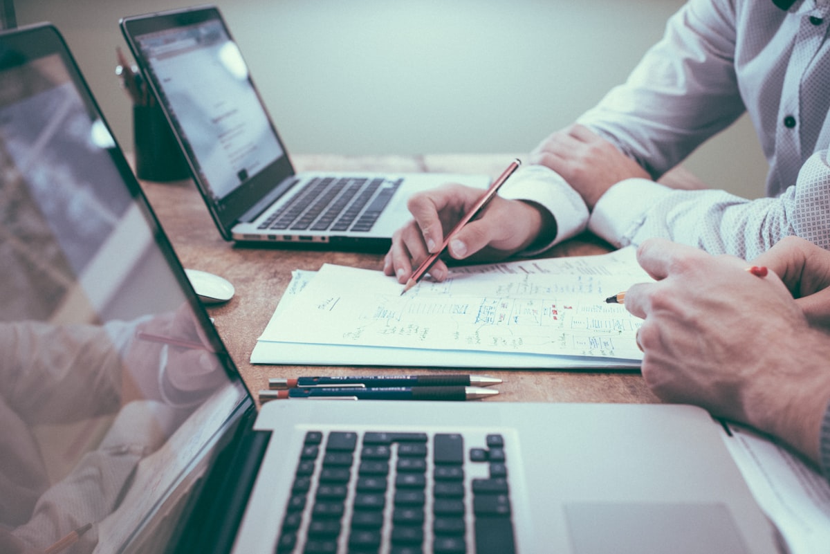 Advisor reviewing investment charts and financial plans with a client